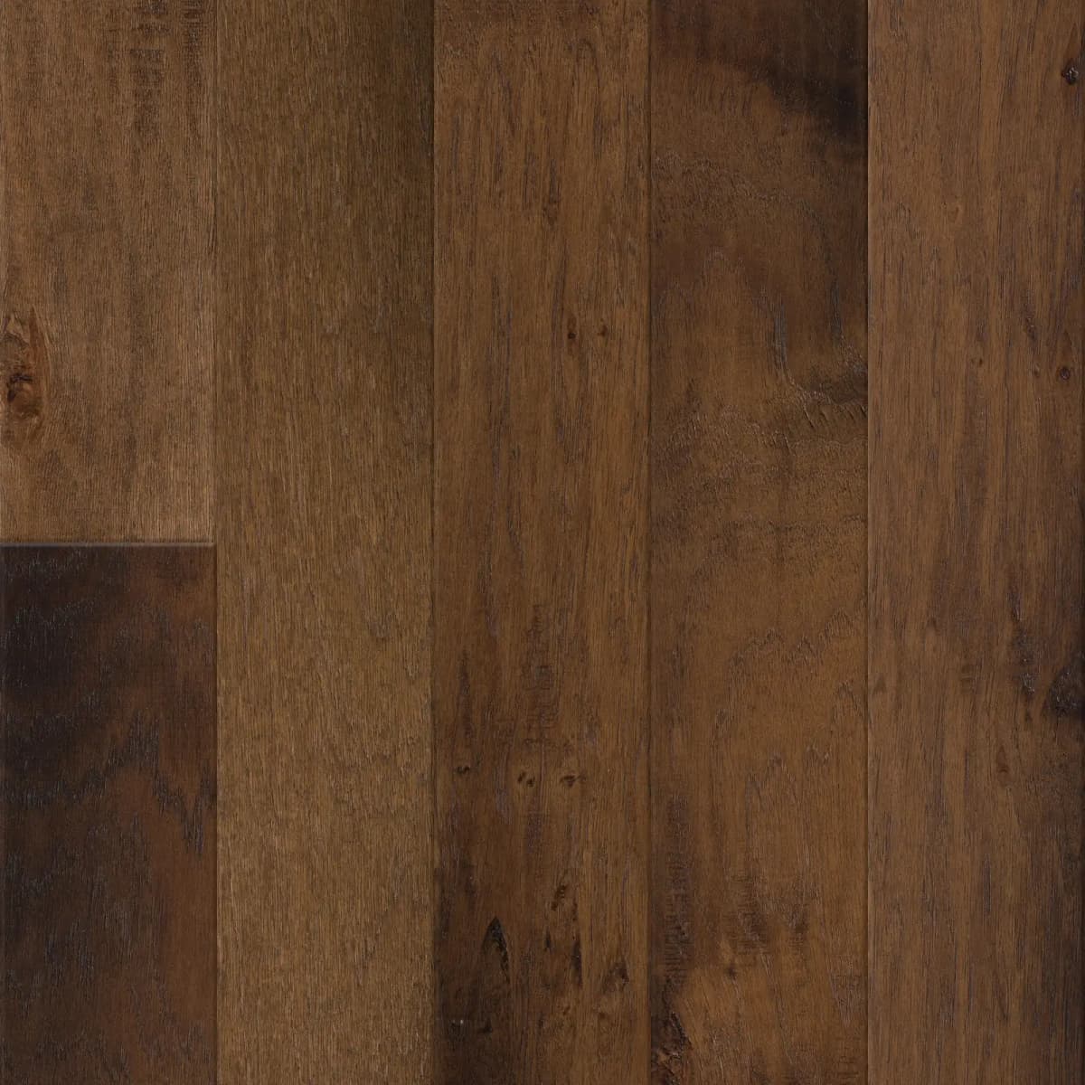 Anderson Tuftex Bernina Hickory flooring close-up with bold color variation and natural grain in warm brown tones