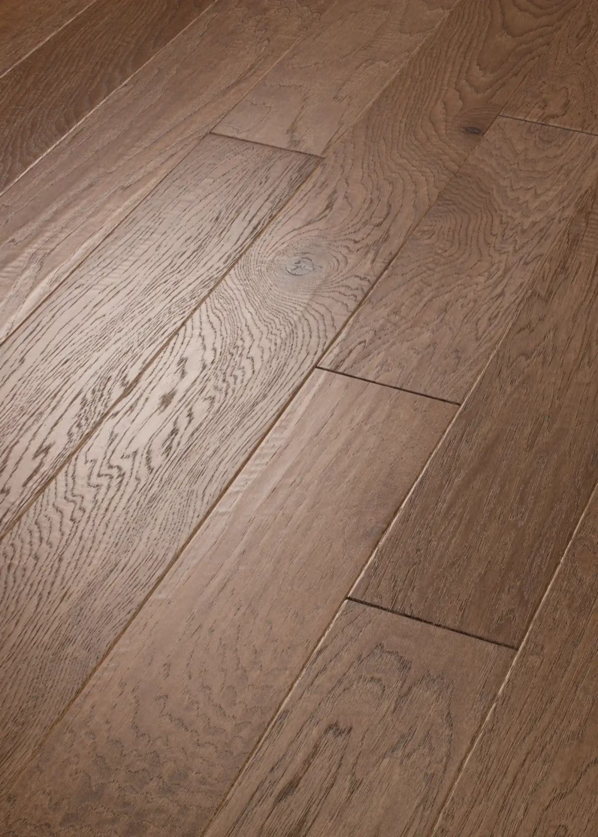 Weathered Gate hickory flooring close-up showing bold grain and color variation between planks