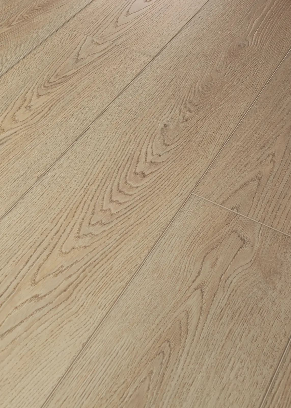 Angled close-up of COREtec wood-look vinyl plank flooring showing the plank face and seam