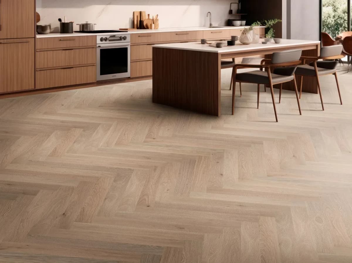 French Buff white oak hardwood in a herringbone pattern grounding a modern kitchen with an island