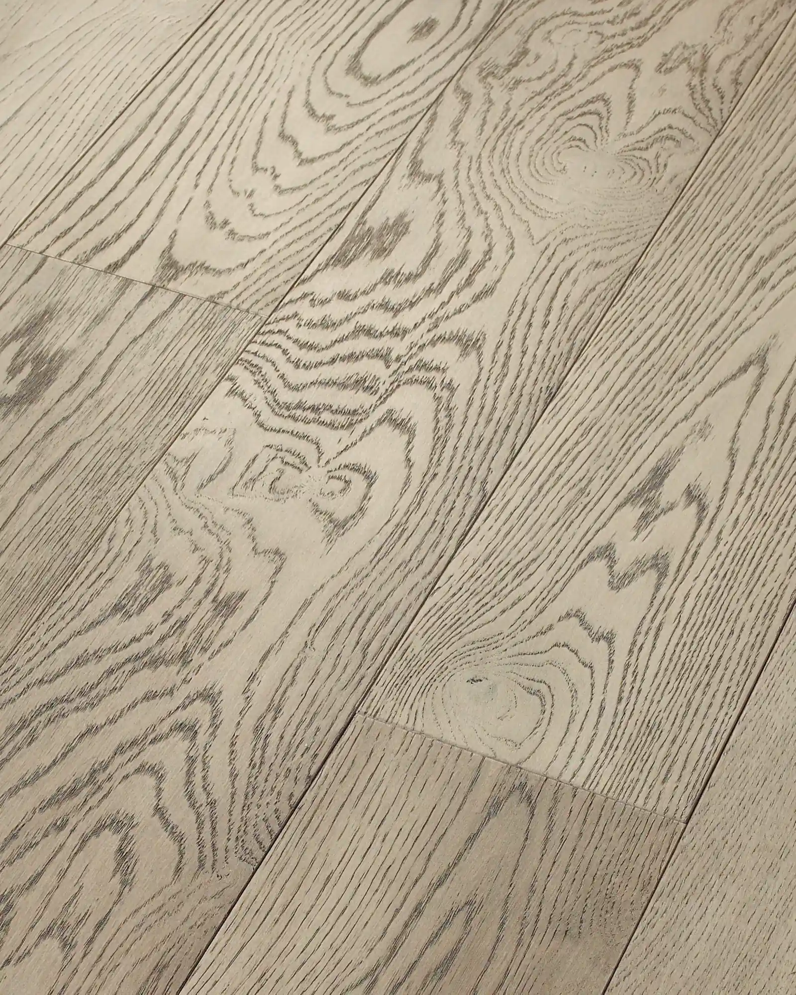 Close-up of Baroness wire-brushed white oak flooring showing deep grain texture and grooves