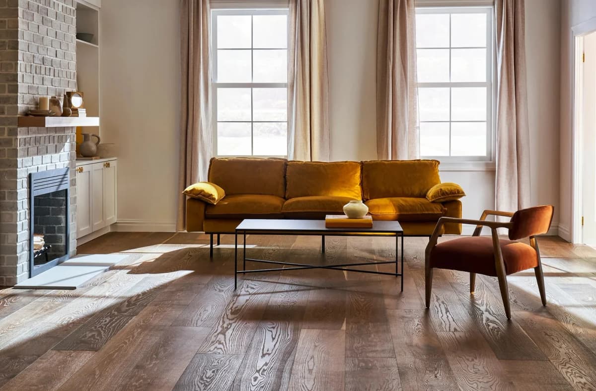 Hatfield House Grand Estate wide-plank white oak flooring with a wire-brushed texture in a sunlit living room