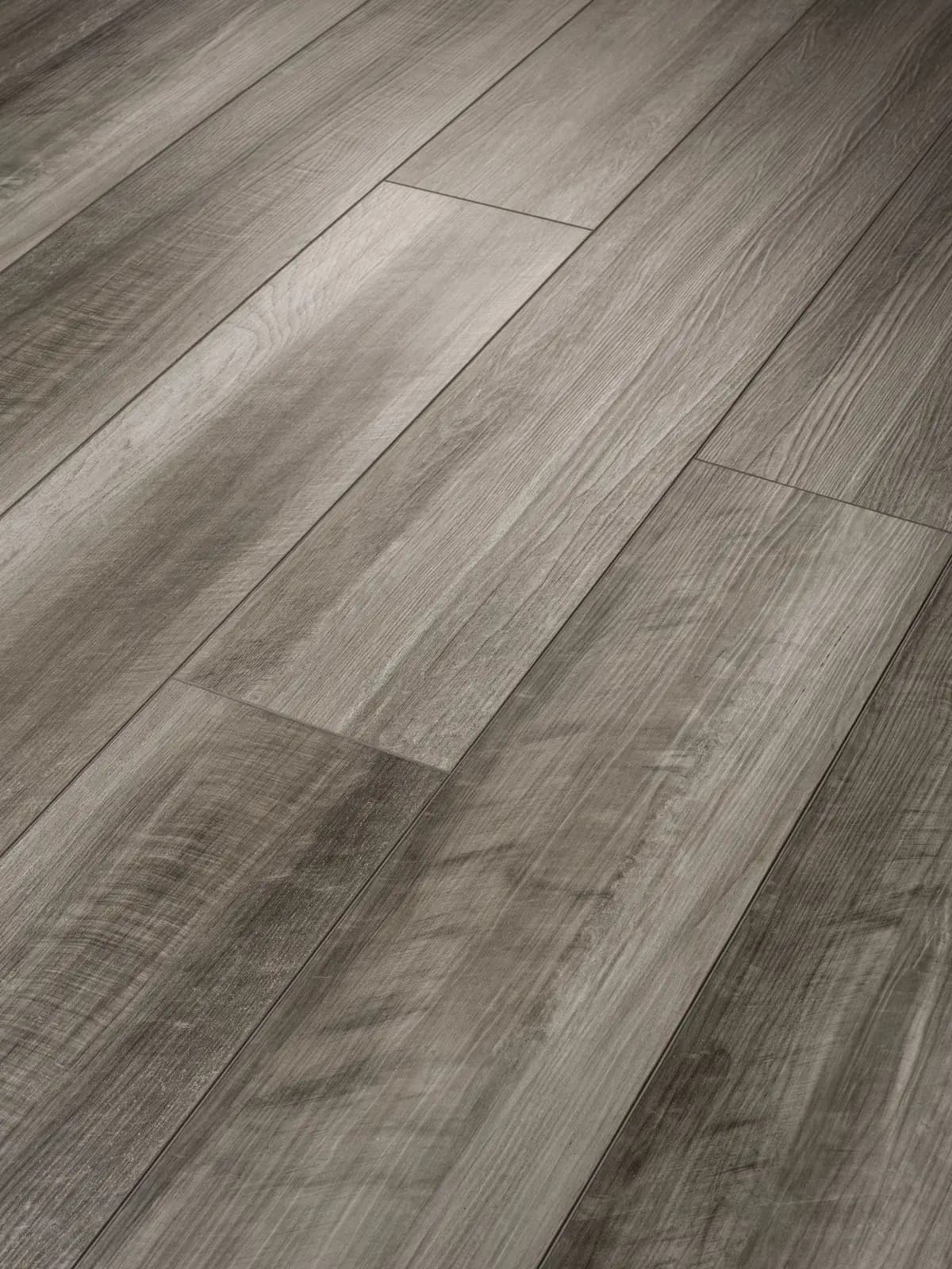 Angled close-up of wood-look vinyl plank flooring showing the seam between boards