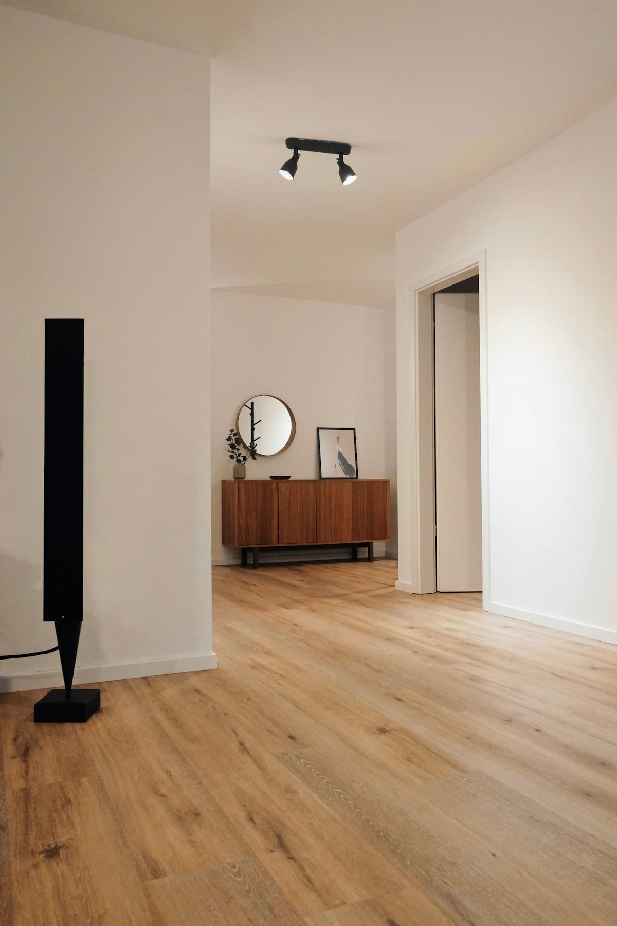 Flooring contractor reviewing installation quote with homeowner in a room with new floors