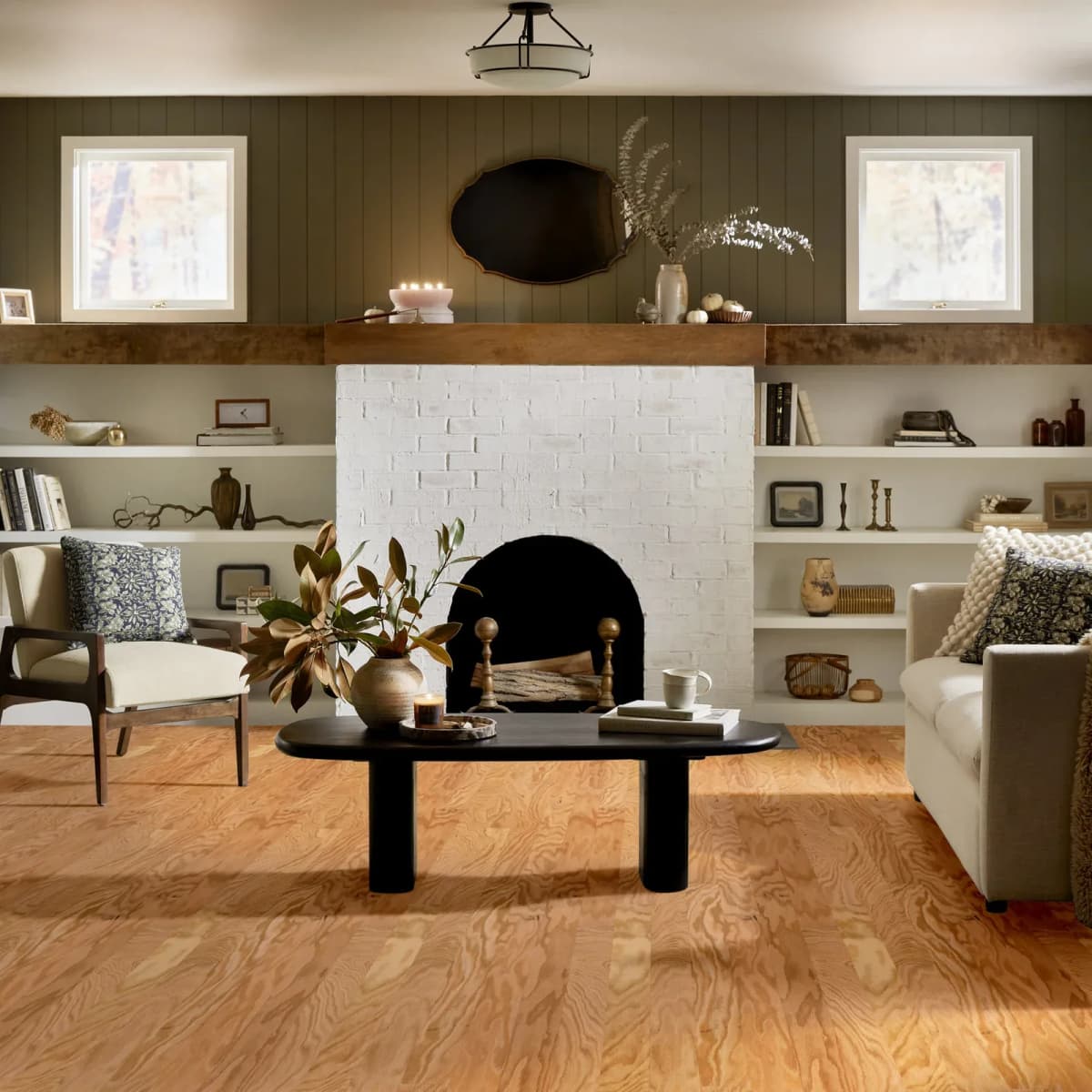 Shaw Albright Oak hardwood flooring in a living room with a fireplace and built-in shelving