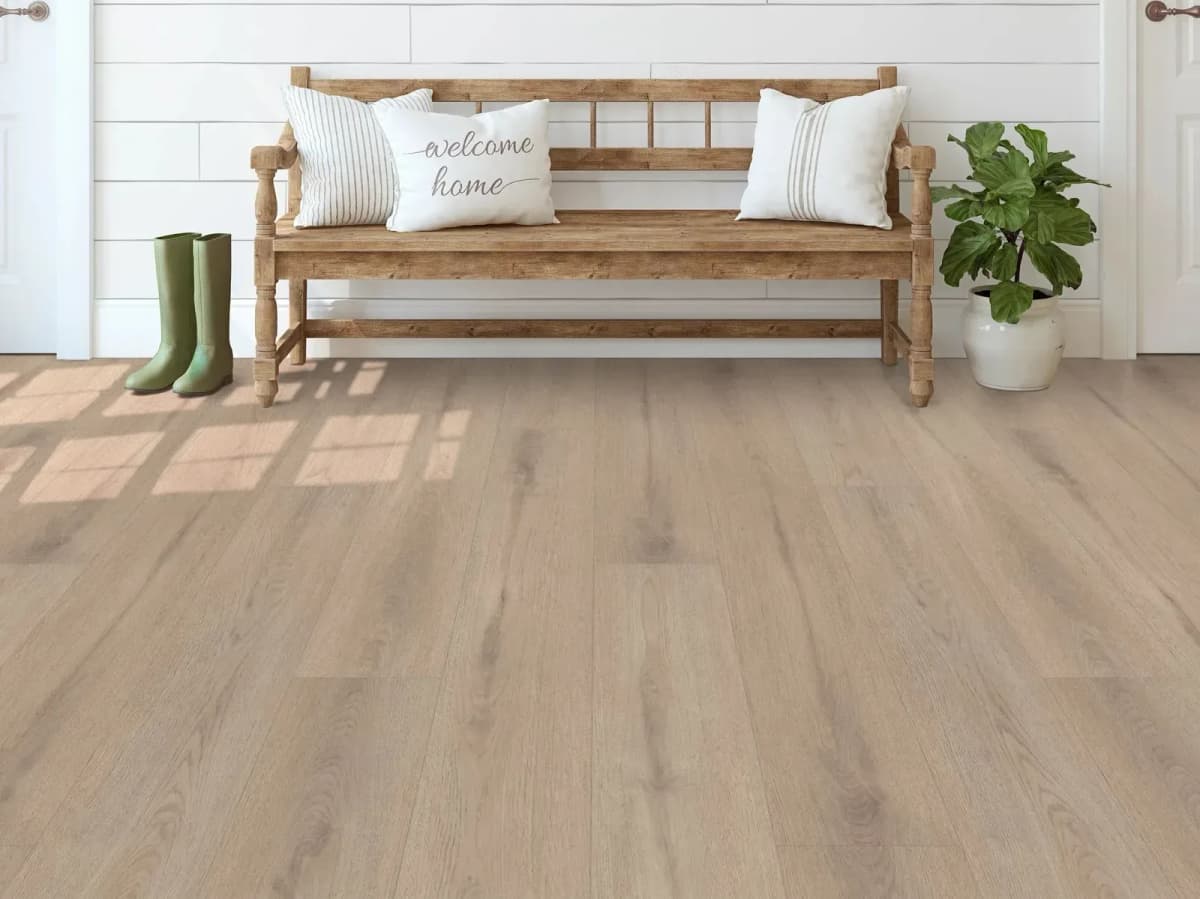 Shaw Journal luxury vinyl plank flooring lines a bright farmhouse-style entryway