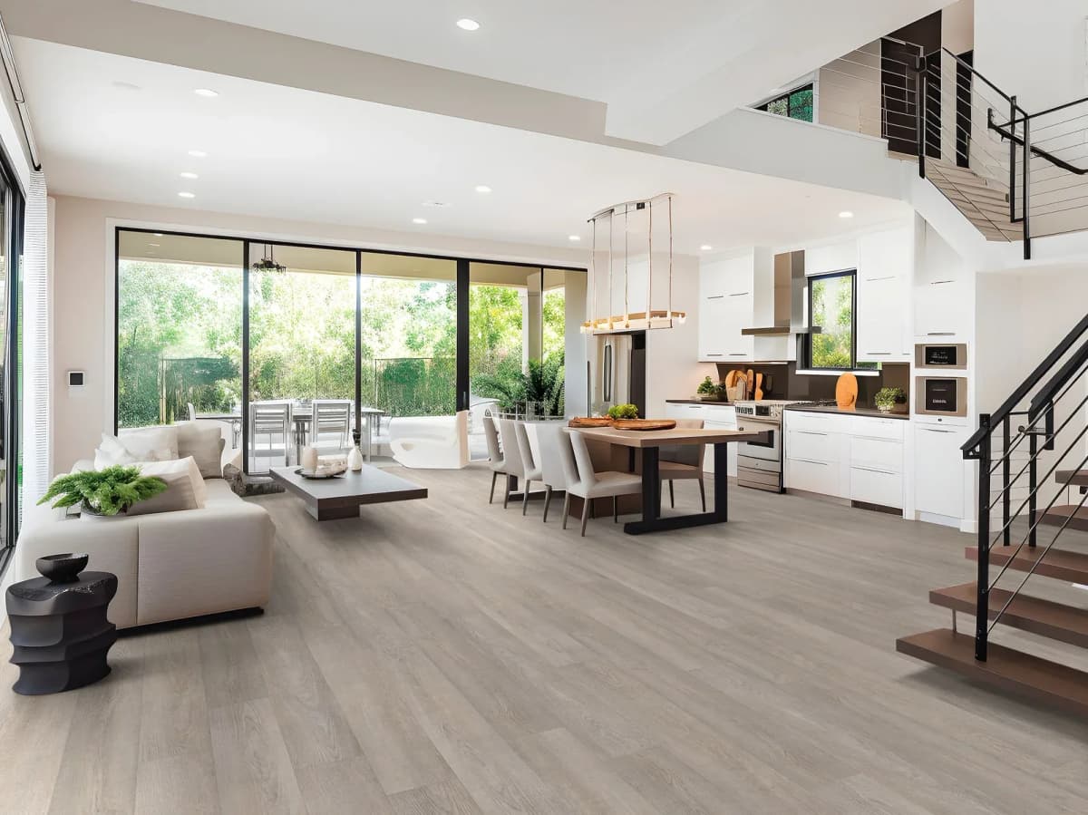 Shaw wood-look vinyl plank flooring spanning an open-concept living, dining, and kitchen space
