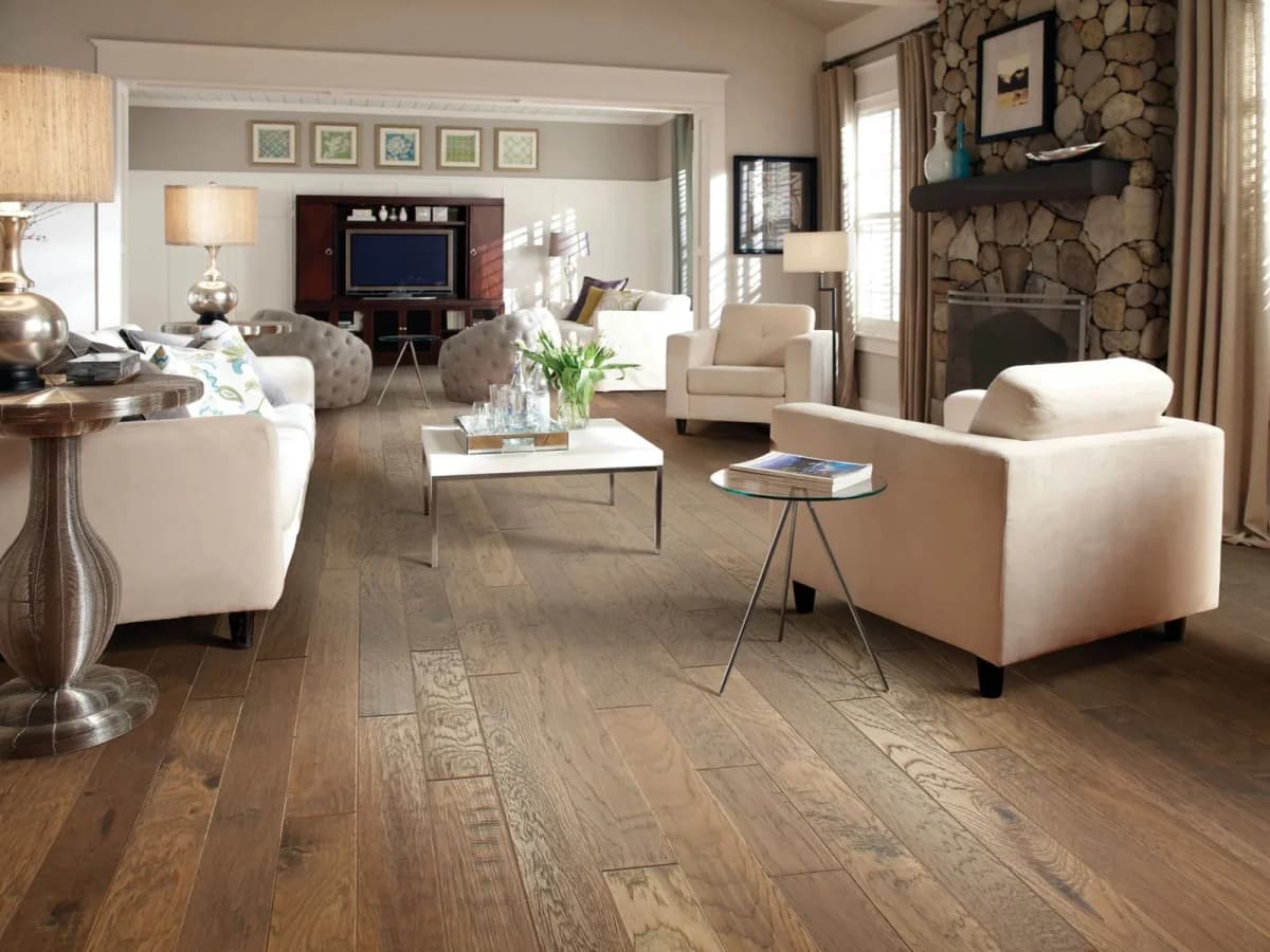 Pebble Hill hickory flooring with tight, flat seams spanning an open living room