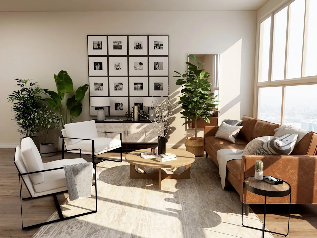 Afternoon sun pouring through a wall of tall windows across a wood-look plank floor in a living room with a leather sofa and two white armchairs