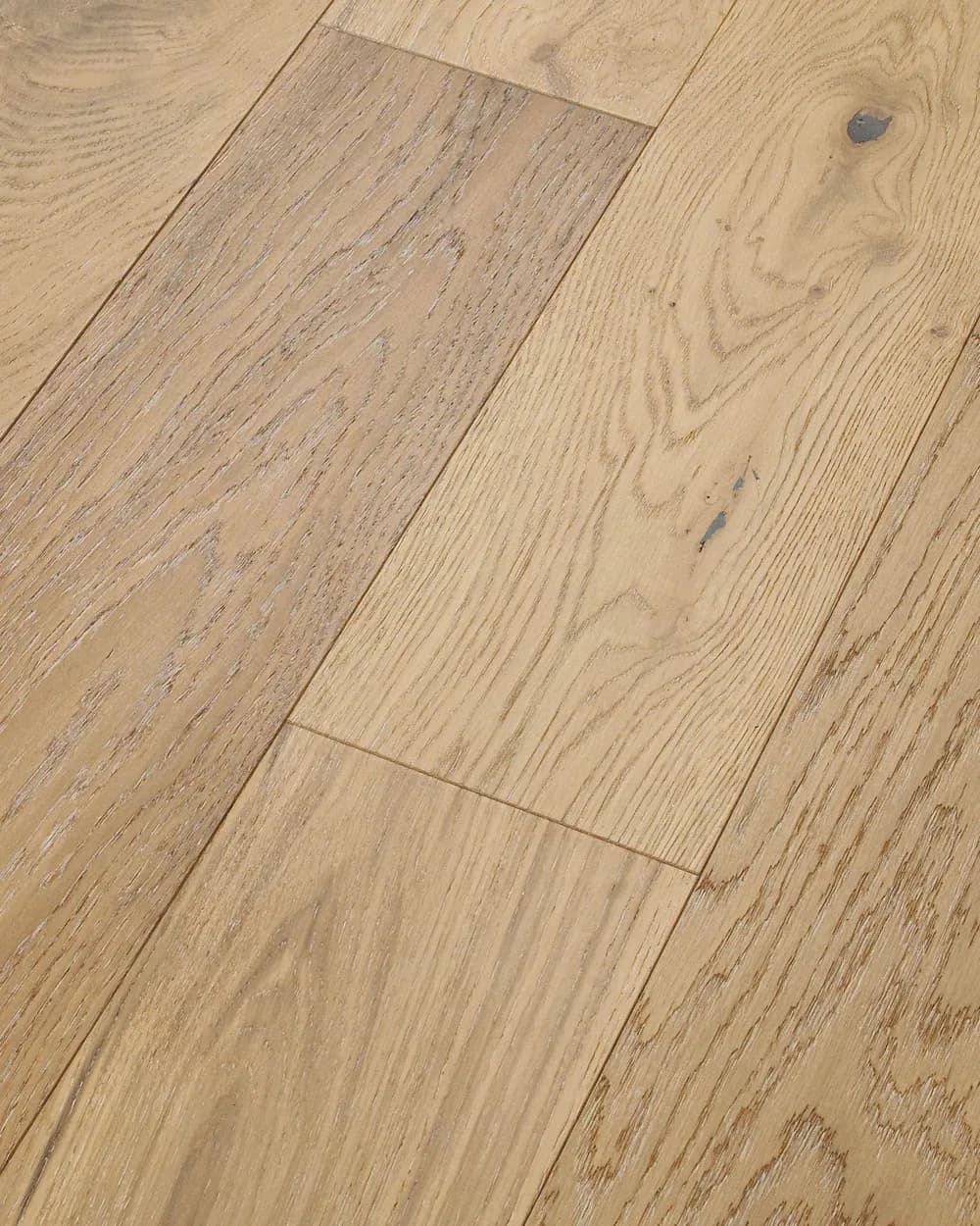 Close view of Anderson Tuftex white oak planks showing open wire-brushed grain in a pale tan tone.