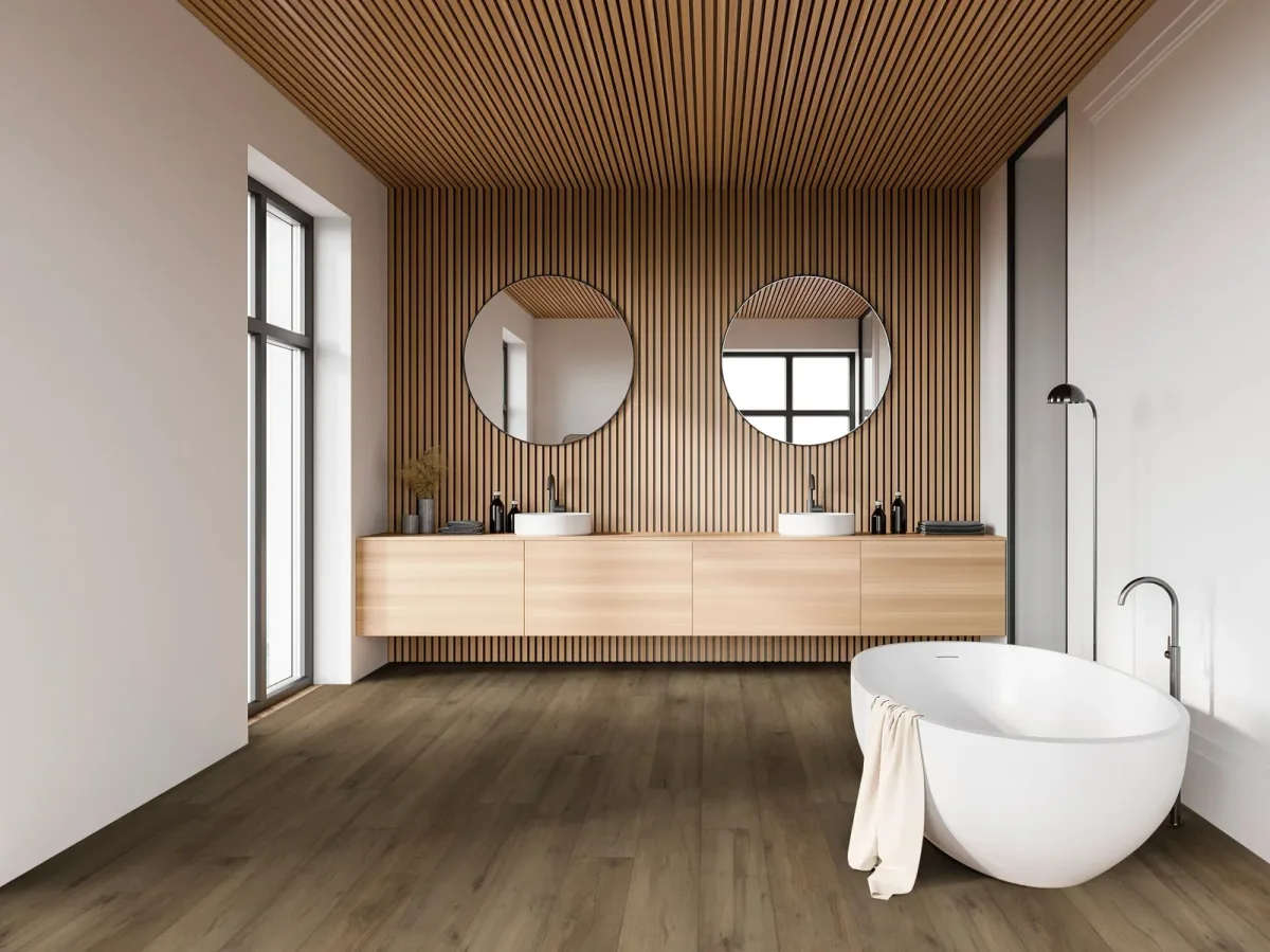 COREtec luxury vinyl plank flooring in a warm mid-brown tone spans a modern bathroom.
